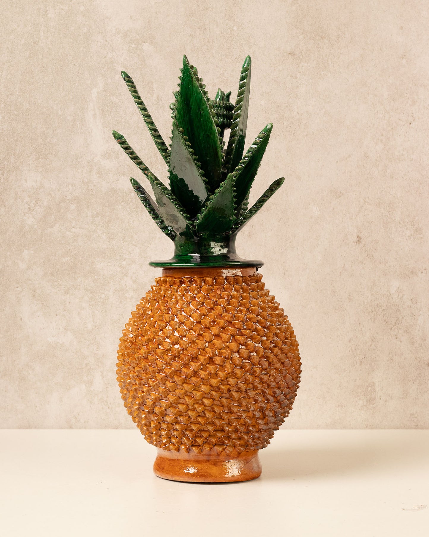 Yellow enameled pineapple "pinch" design with agave green leaves