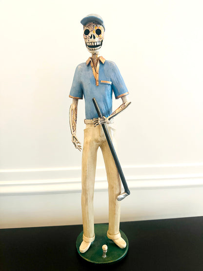 Golfer Catrina with a blue t-shirt handmade with clay ceramic