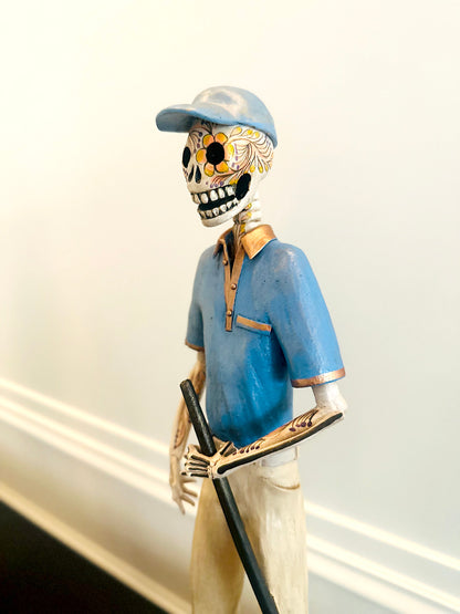 Golfer Catrina with a blue t-shirt handmade with clay ceramic